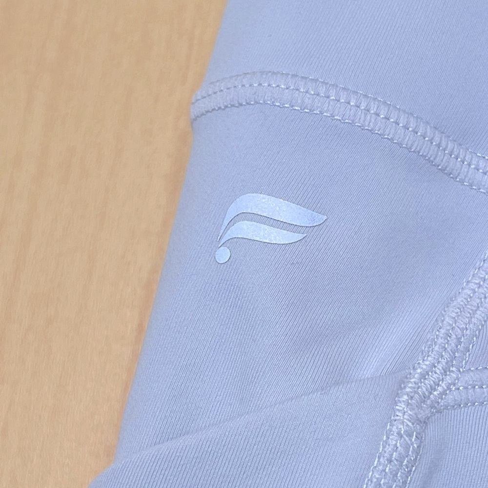 Fabletics Oasis High-Waisted Pocket Shorts 9"